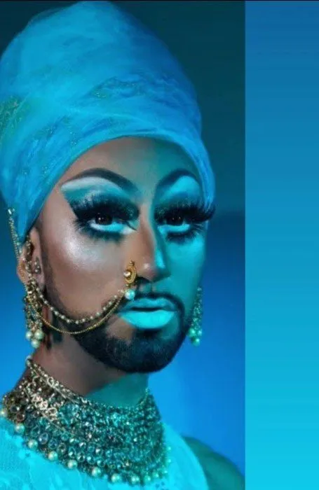 Drag artist Mango Lassi in a turquoise headwrap, from a Desi Rainbow Story Time.